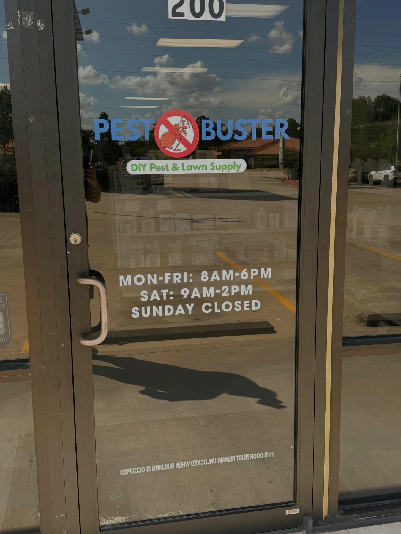 Pest Buster Texas front door displaying the store logo and business hours