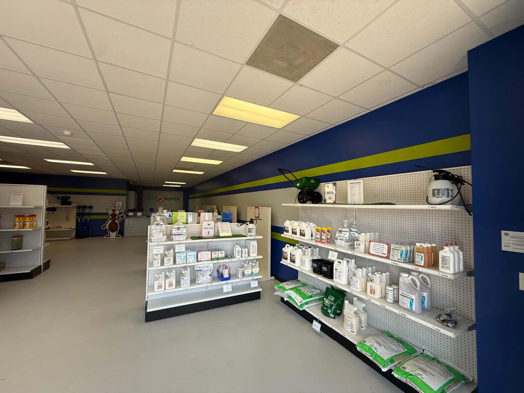 Interior of Pest Buster Texas with pest control and lawn products displayed on store shelves