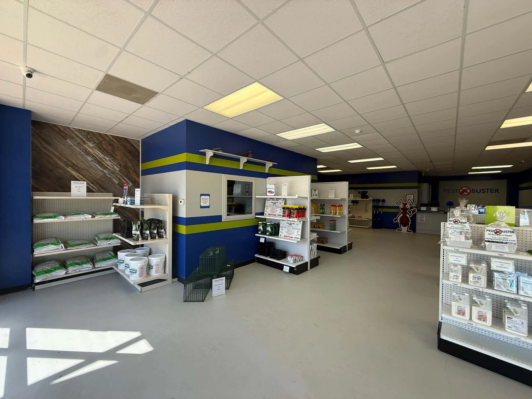 Wide interior view of Pest Buster Texas showing product aisles and pest control supplies